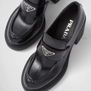 Prada Chocolate high-heeled brushed leather loafers
$ 1,250 size 38